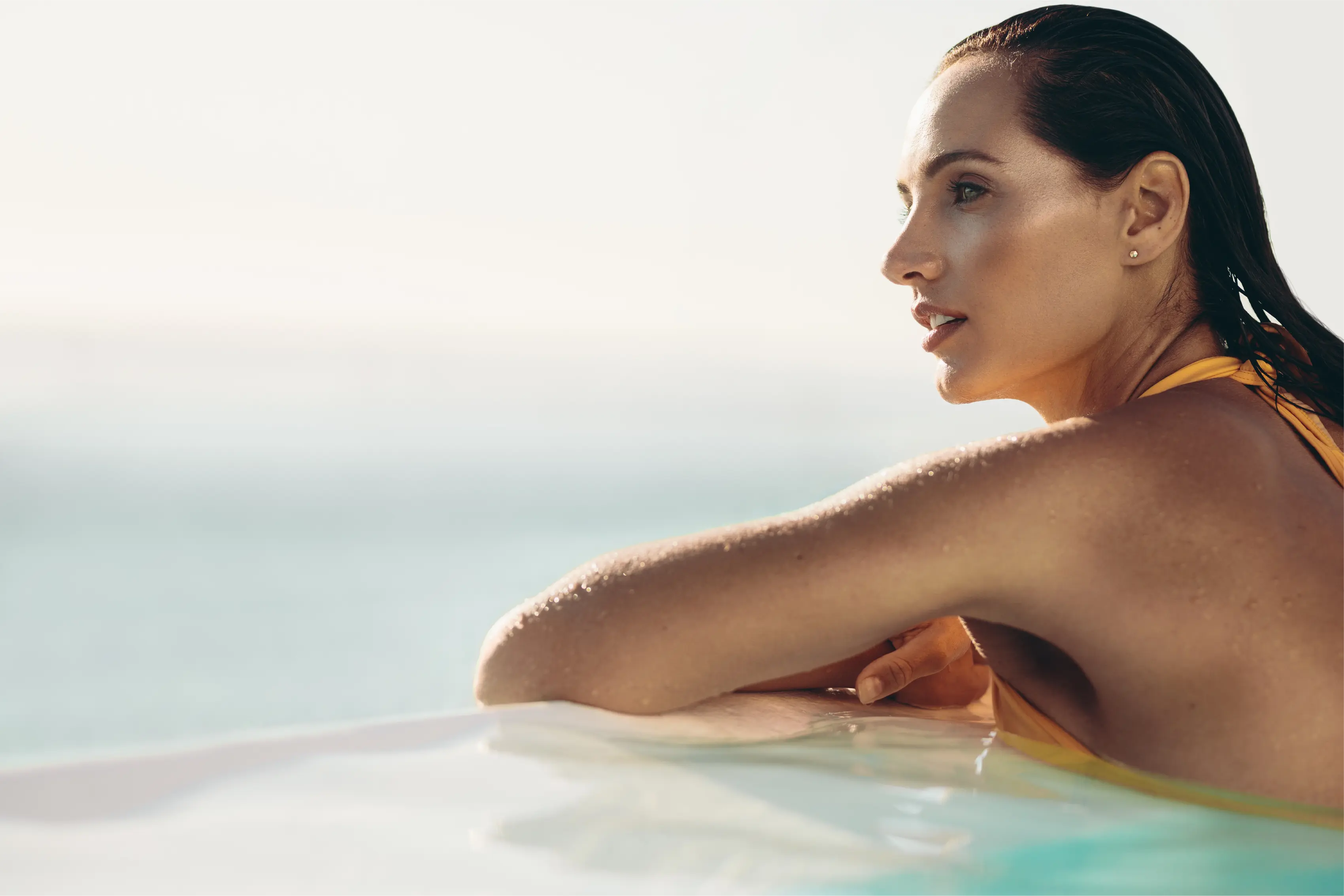 Woman standing at the pool side